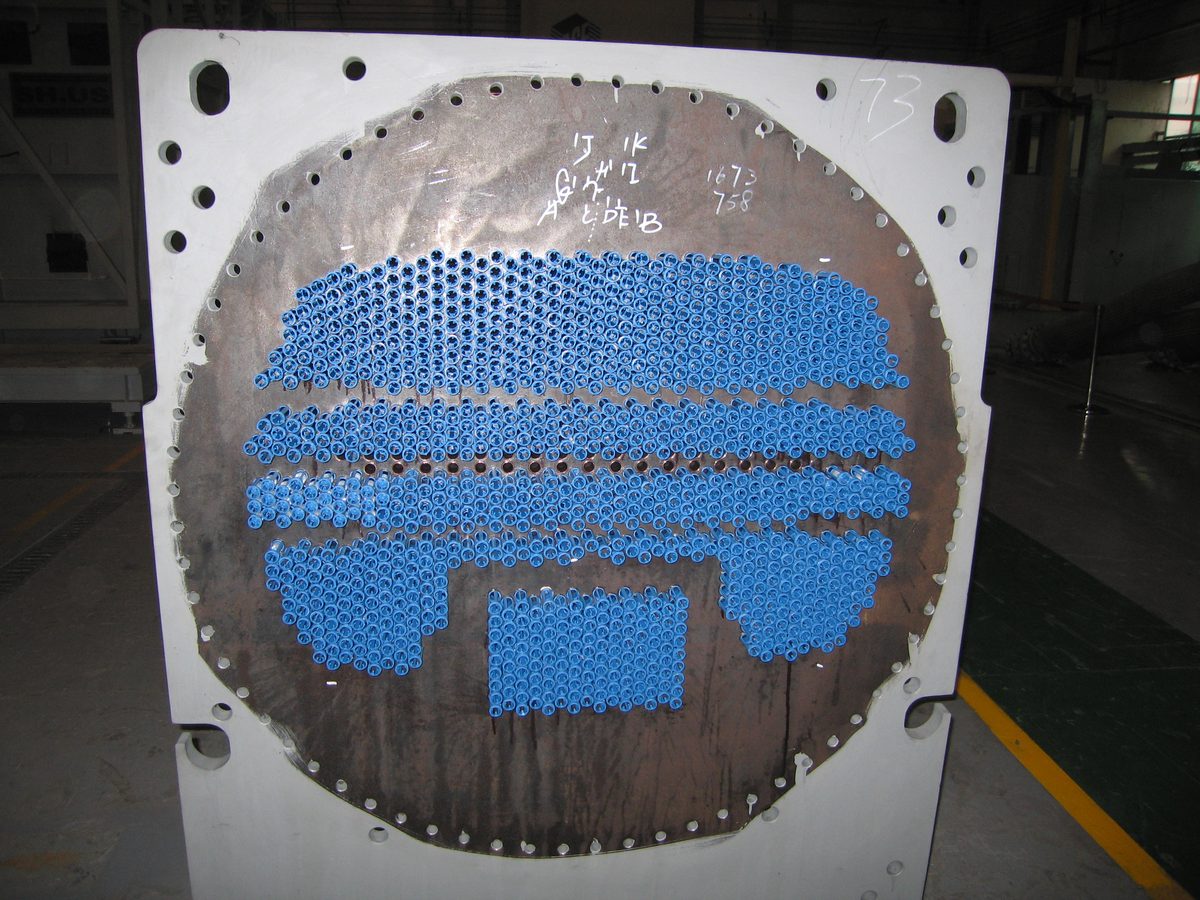 Automatic tube brush cleaning system — brush cages installed at the tube sheet of a large chiller condenser